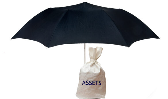 Bag of assets shielded by umbrella