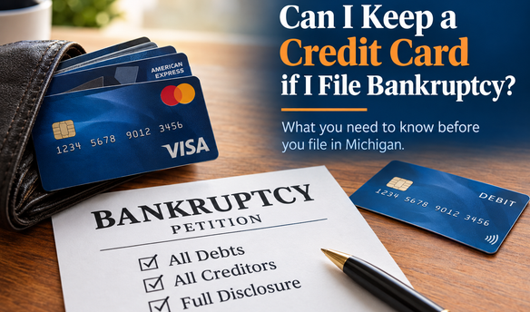 Can I keep a credit card if I file bankruptcy? Credit cards beside a Michigan bankruptcy petition and debit card.